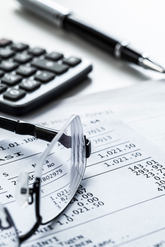 Eyeglasses with calculator on table